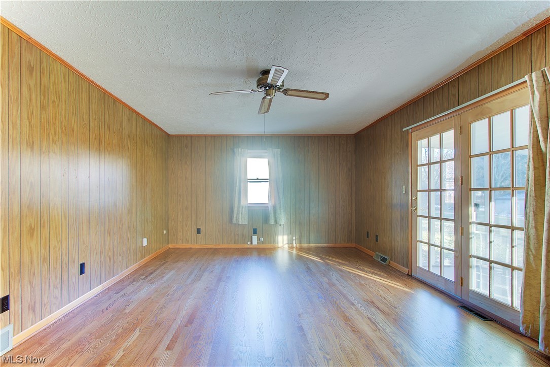 1998 Bridger Road Akron, OH 44312 - Photo 6 of 32 Family/rec room with light wood-type flooring and wood walls