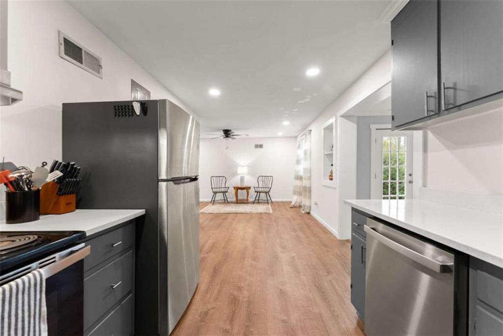 114 Duke Street Jefferson, GA 30549 - Photo 12 of 46 a kitchen with stainless steel appliances a refrigerator and a sink