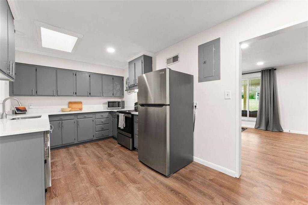 114 Duke Street Jefferson, GA 30549 - Photo 16 of 46 a kitchen with stainless steel appliances a refrigerator sink and cabinets