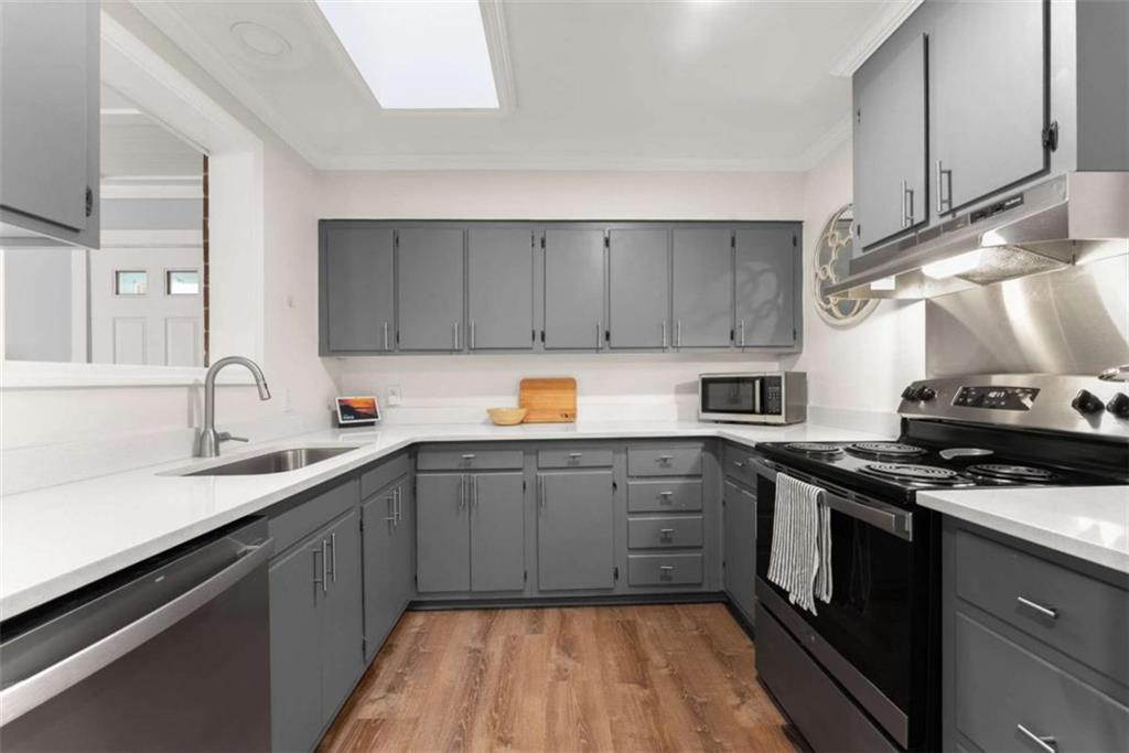 114 Duke Street Jefferson, GA 30549 - Photo 17 of 46 a kitchen with a sink cabinets and stainless steel appliances