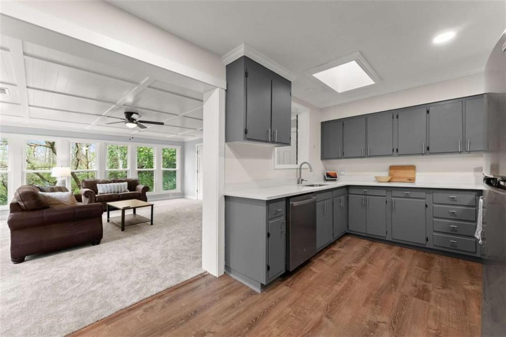 114 Duke Street Jefferson, GA 30549 - Photo 18 of 46 a kitchen with sink cabinets and window