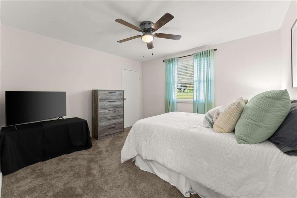 114 Duke Street Jefferson, GA 30549 - Photo 23 of 46 a bedroom with a bed and window