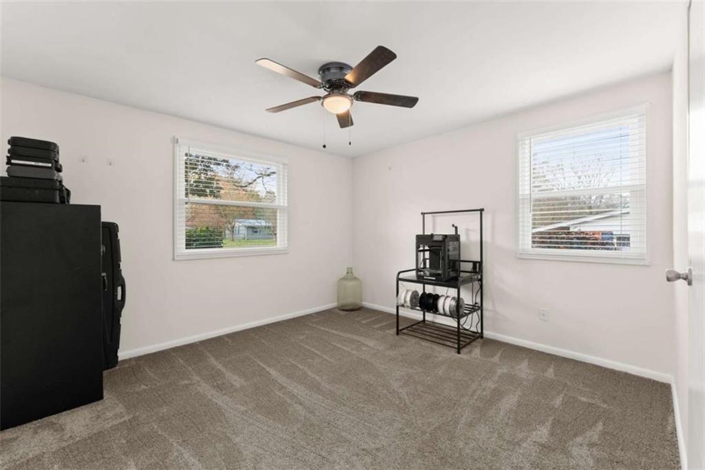 114 Duke Street Jefferson, GA 30549 - Photo 26 of 46 a living room with furniture and a window