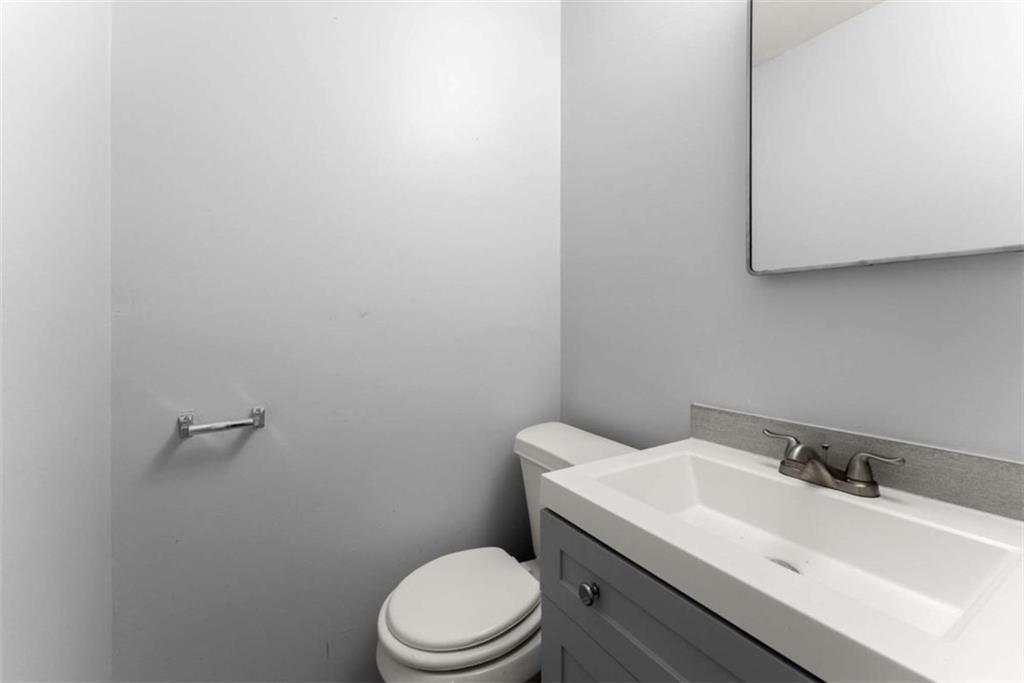 114 Duke Street Jefferson, GA 30549 - Photo 27 of 46 a bathroom with a sink a toilet and mirror