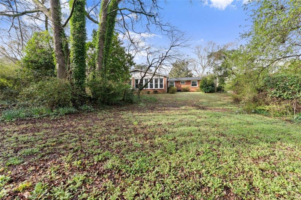 114 Duke Street Jefferson, GA 30549 - Photo 33 of 46 a view of a yard with plants and trees