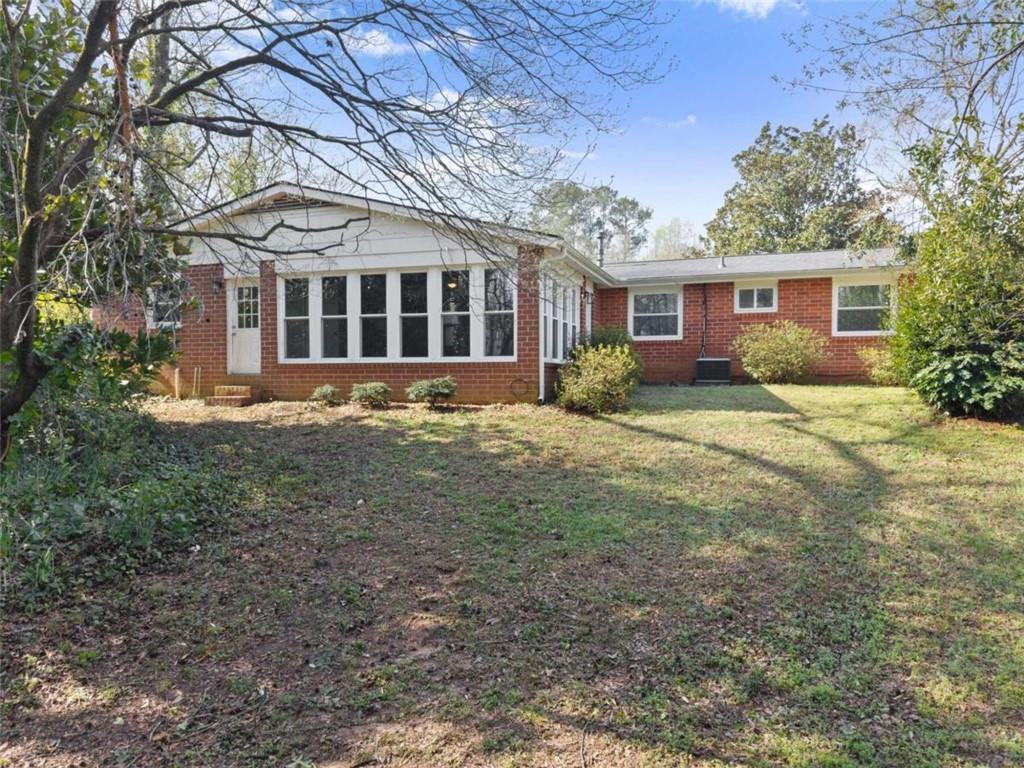 114 Duke Street Jefferson, GA 30549 - Photo 36 of 46 a front view of a house with a garden