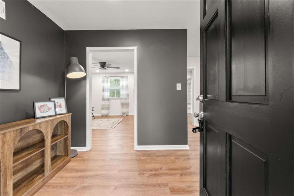 114 Duke Street Jefferson, GA 30549 - Photo 7 of 46 a view of a kitchen from the hallway
