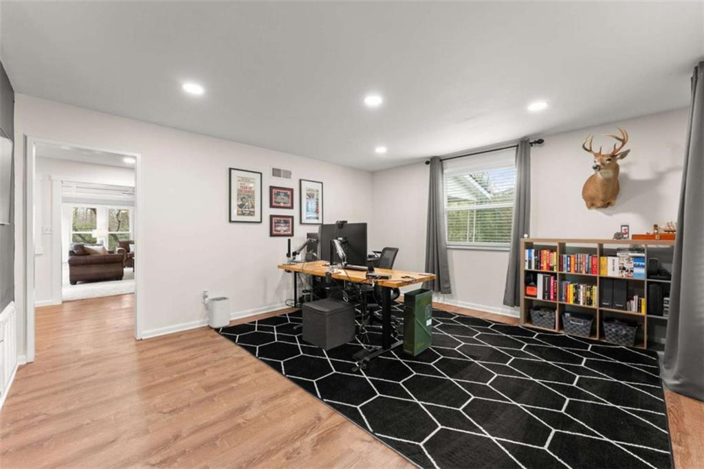 114 Duke Street Jefferson, GA 30549 - Photo 9 of 46 a workspace with wooden floor