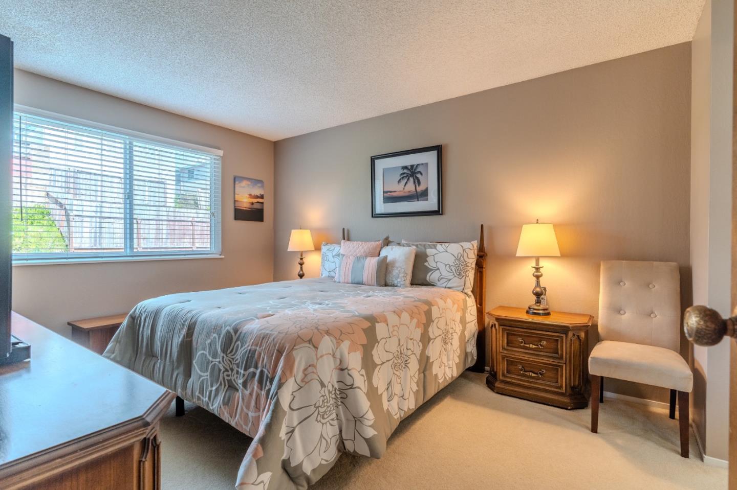 42 Eastridge Circle Pacifica, CA 94044 - Photo 19 of 33 a bedroom with a bed and dresser with mirror