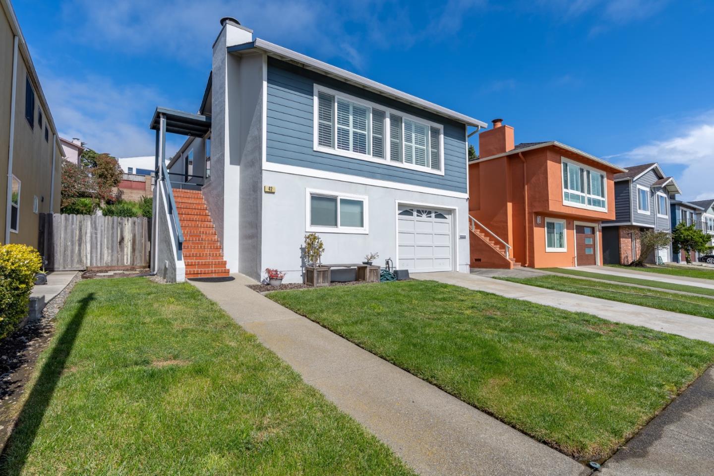 42 Eastridge Circle Pacifica, CA 94044 - Photo 2 of 33 a front view of a house with a yard
