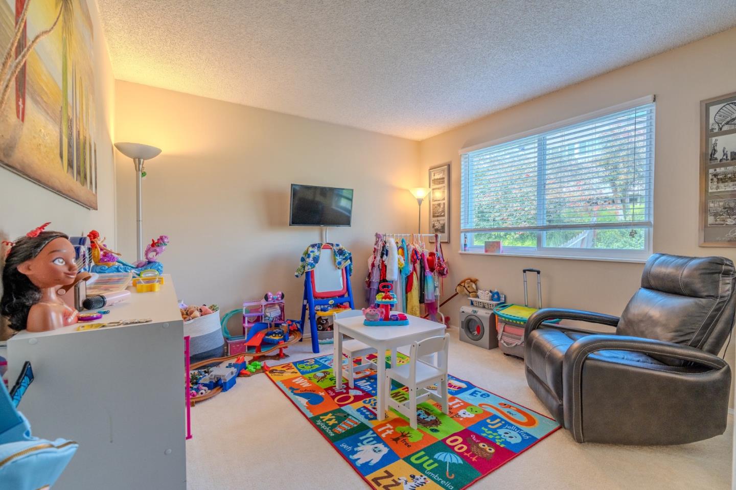 42 Eastridge Circle Pacifica, CA 94044 - Photo 24 of 33 a bed room with furniture and a flat screen tv