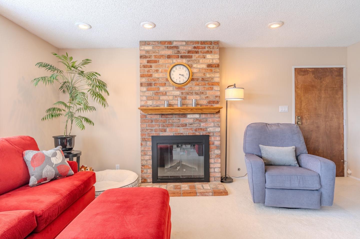 42 Eastridge Circle Pacifica, CA 94044 - Photo 5 of 33 a living room with furniture and a fireplace