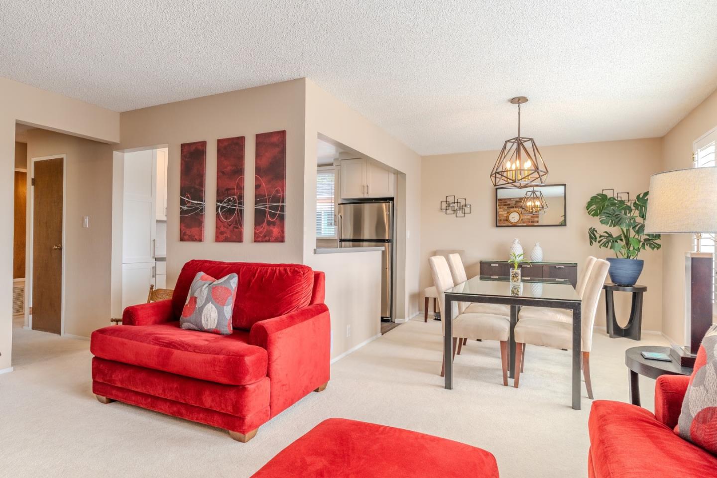 42 Eastridge Circle Pacifica, CA 94044 - Photo 7 of 33 a living room with furniture and a chandelier