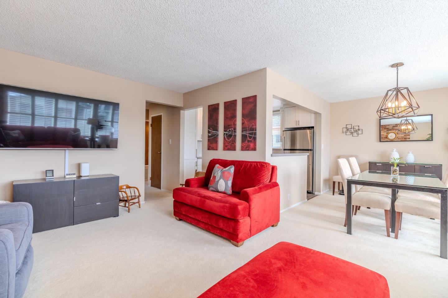 42 Eastridge Circle Pacifica, CA 94044 - Photo 8 of 33 a living room with furniture and a flat screen tv