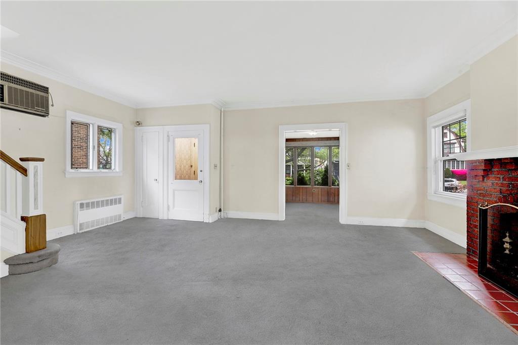 8016 Colonial Road Brooklyn, NY 11209 - Photo 11 of 43 a view of empty room with floor to ceiling window and fireplace