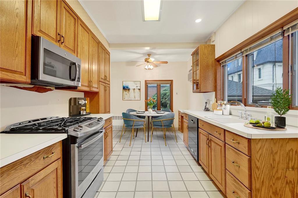 8016 Colonial Road Brooklyn, NY 11209 - Photo 19 of 43 a kitchen with stainless steel appliances granite countertop a sink stove and cabinets