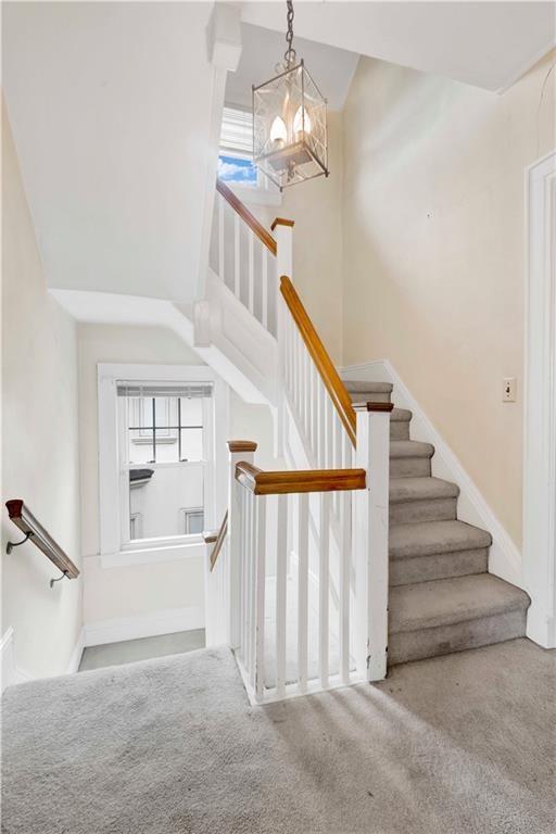 8016 Colonial Road Brooklyn, NY 11209 - Photo 33 of 43 a view of staircase with white walls and chandelier