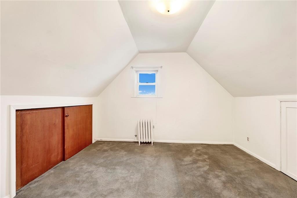 8016 Colonial Road Brooklyn, NY 11209 - Photo 35 of 43 an empty room with wooden door