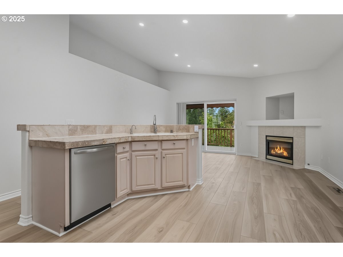 3379 Northwest Banff Drive Portland, OR 97229 - Photo 13 of 26 a kitchen with a sink cabinets and wooden floor