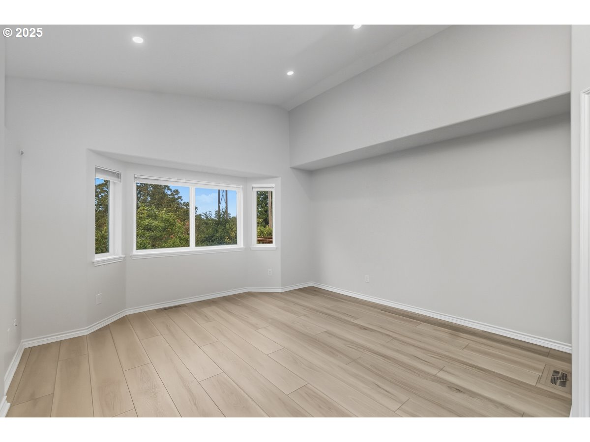 3379 Northwest Banff Drive Portland, OR 97229 - Photo 15 of 26 a view of an empty room with a window
