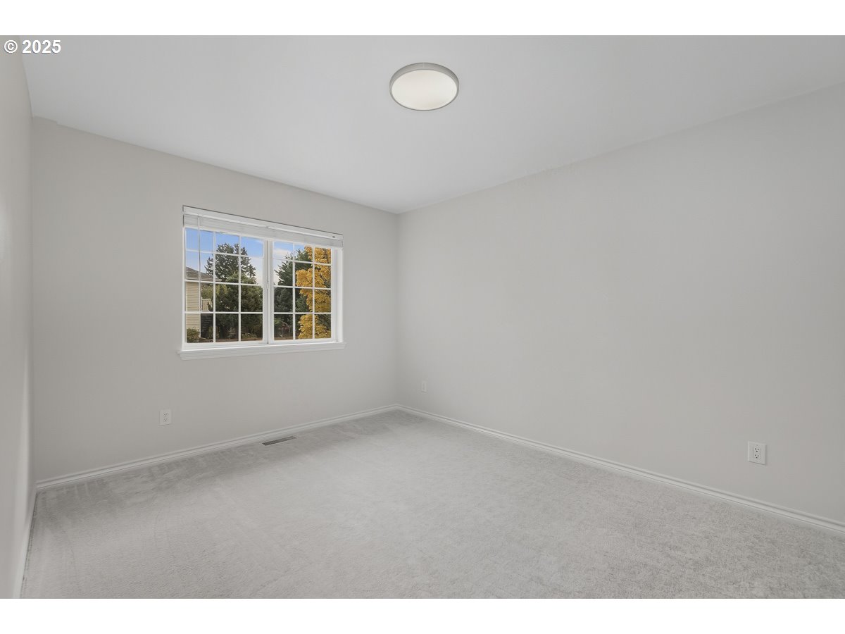 3379 Northwest Banff Drive Portland, OR 97229 - Photo 19 of 26 a view of an empty room with a window