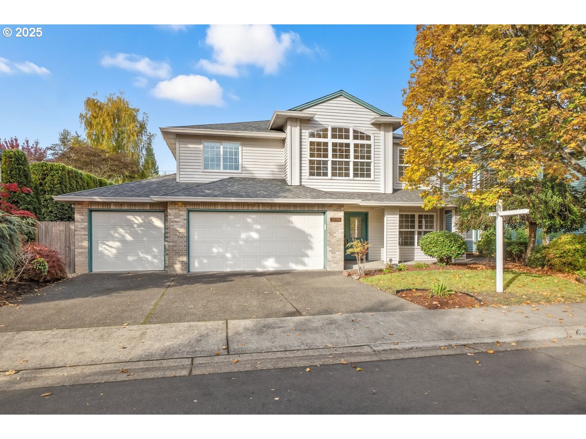 3379 Northwest Banff Drive Portland, OR 97229 - Photo 2 of 26 a front view of a house with garden