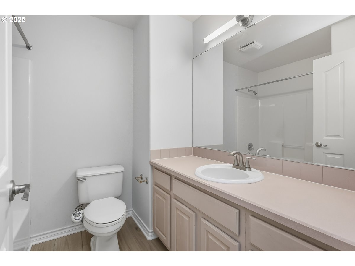 3379 Northwest Banff Drive Portland, OR 97229 - Photo 21 of 26 a bathroom with a sink a toilet and mirror