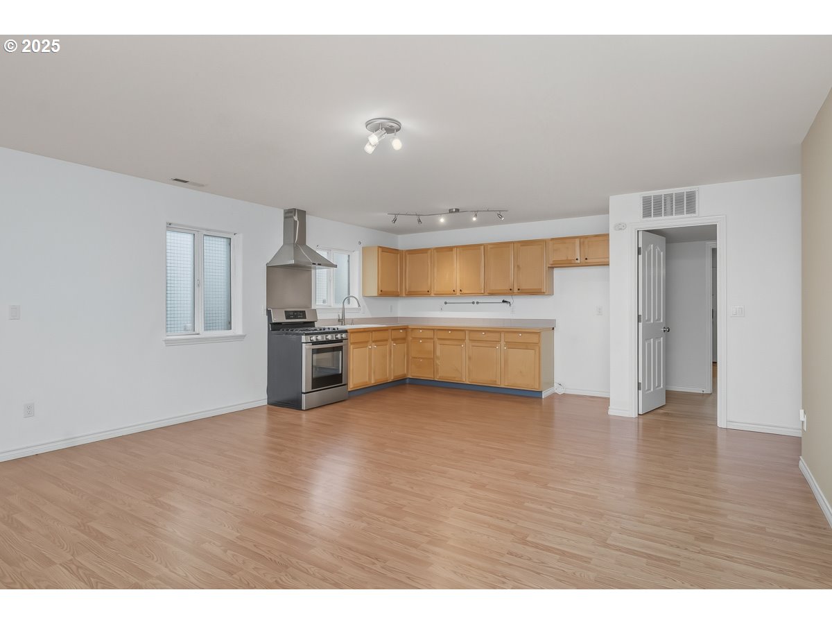 3379 Northwest Banff Drive Portland, OR 97229 - Photo 25 of 26 a view of a kitchen with a sink and a refrigerator