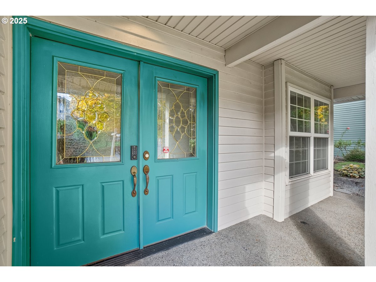 3379 Northwest Banff Drive Portland, OR 97229 - Photo 3 of 26 a view of a front door and a window