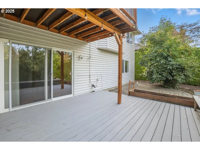 a view of outdoor space with wooden floor and yard