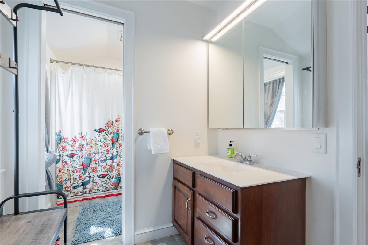413 Grant Street Normal, IL 61761 - Photo 18 of 40 a bathroom with a sink vanity and a mirror