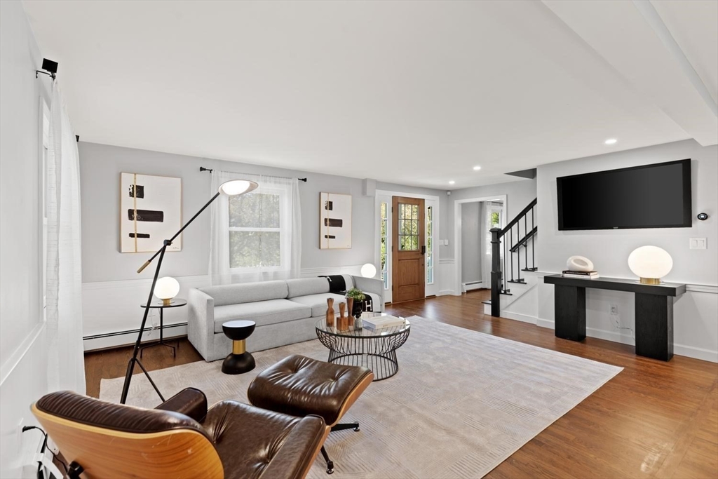 5 Alpine Circle Wakefield, MA 01880 - Photo 11 of 42 a living room with furniture and a flat screen tv