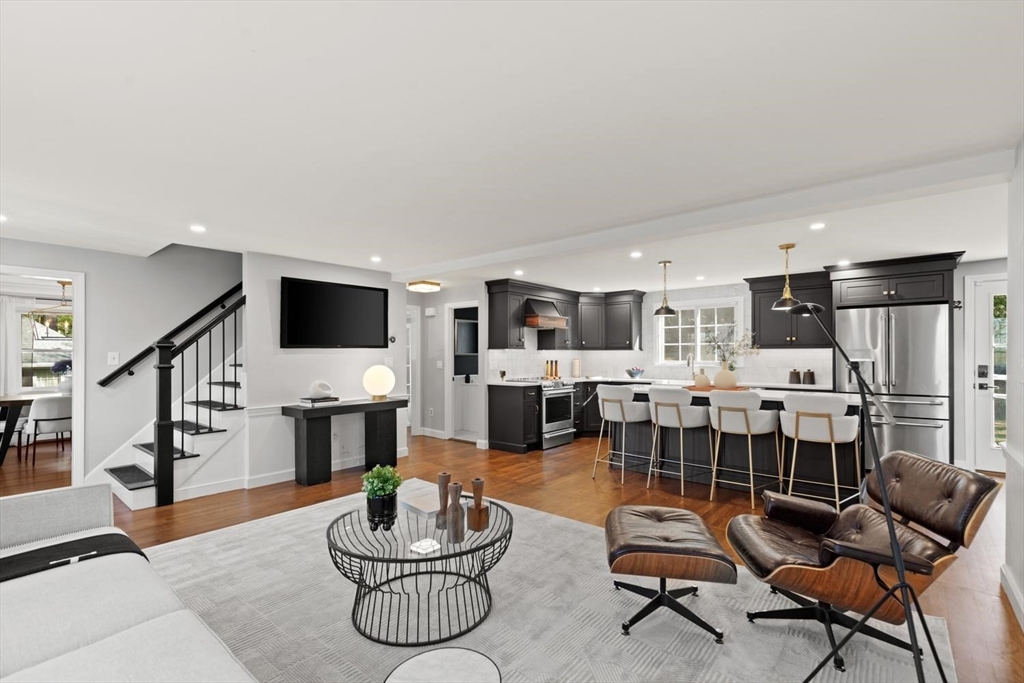 5 Alpine Circle Wakefield, MA 01880 - Photo 12 of 42 a living room with furniture kitchen view and a flat screen tv