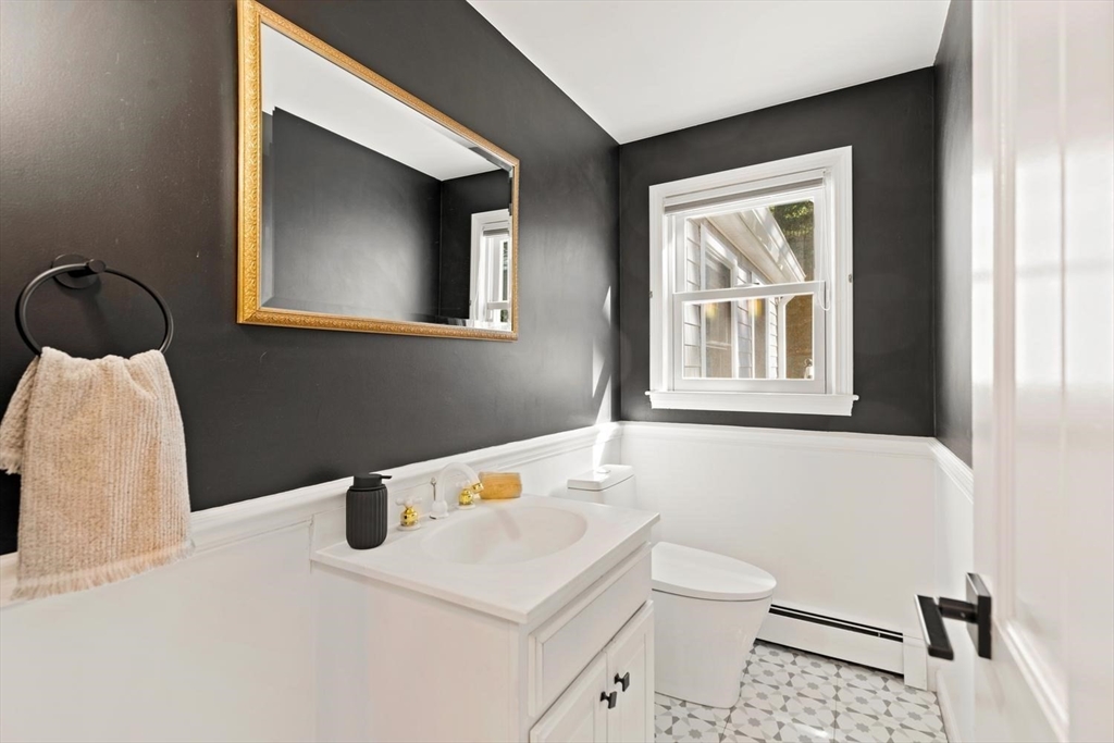 5 Alpine Circle Wakefield, MA 01880 - Photo 28 of 42 a bathroom with a sink a toilet and a window