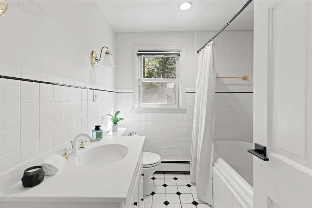5 Alpine Circle Wakefield, MA 01880 - Photo 34 of 42 a bathroom with a sink a toilet and shower