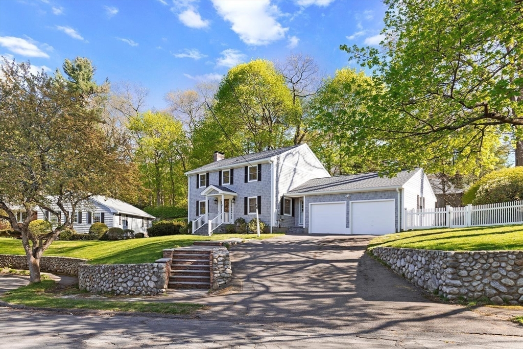 5 Alpine Circle Wakefield, MA 01880 - Photo 6 of 42 a front view of a house with a garden