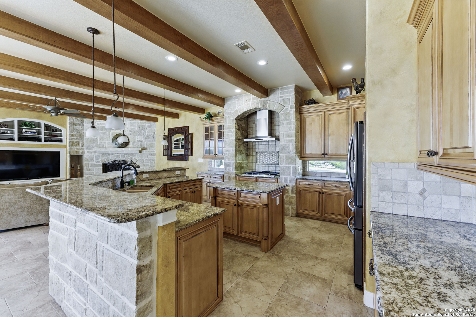 211 Macaw Lane Spring Branch, TX 78070 - Photo 13 of 85 a kitchen with stainless steel appliances granite countertop a sink and cabinets