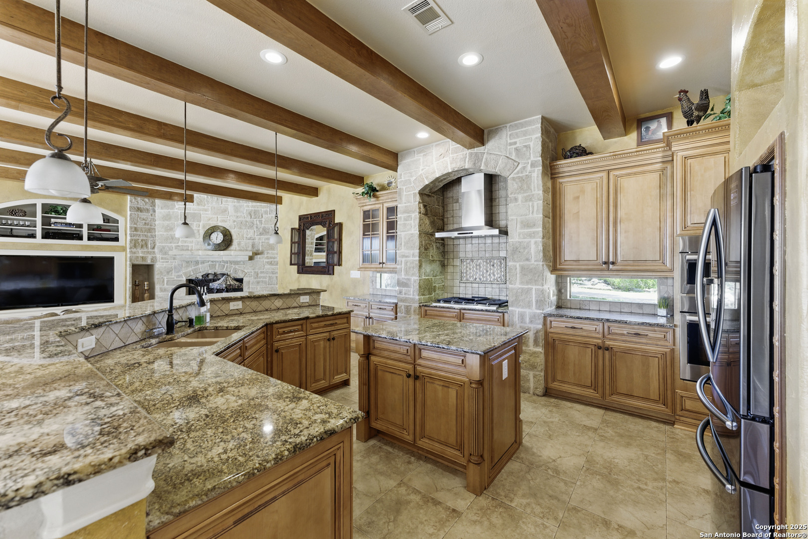 211 Macaw Lane Spring Branch, TX 78070 - Photo 14 of 85 a kitchen with stainless steel appliances granite countertop a sink stove and refrigerator