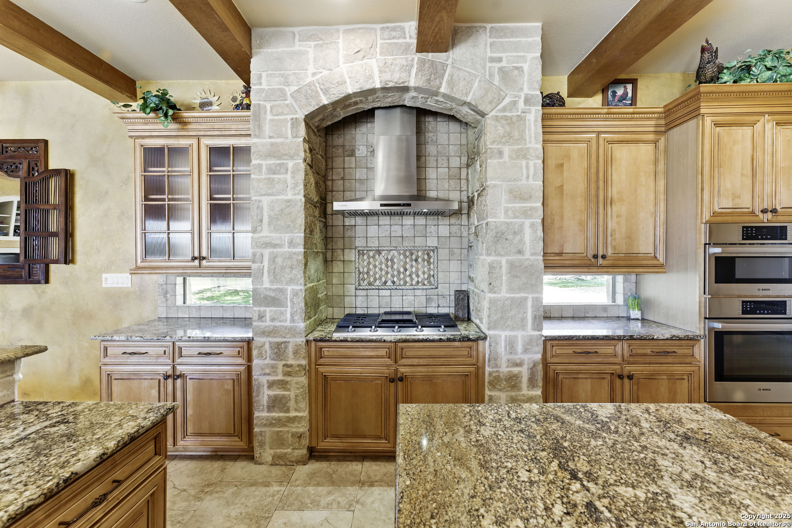 211 Macaw Lane Spring Branch, TX 78070 - Photo 15 of 85 a kitchen with a stove a sink and a refrigerator