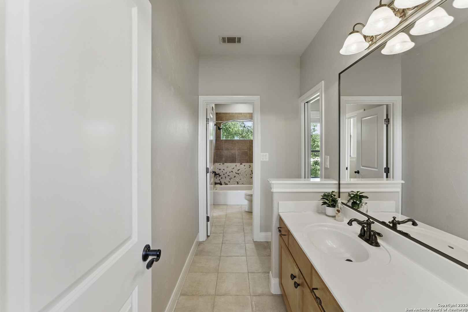 211 Macaw Lane Spring Branch, TX 78070 - Photo 36 of 85 a bathroom with a double vanity sink and a mirror