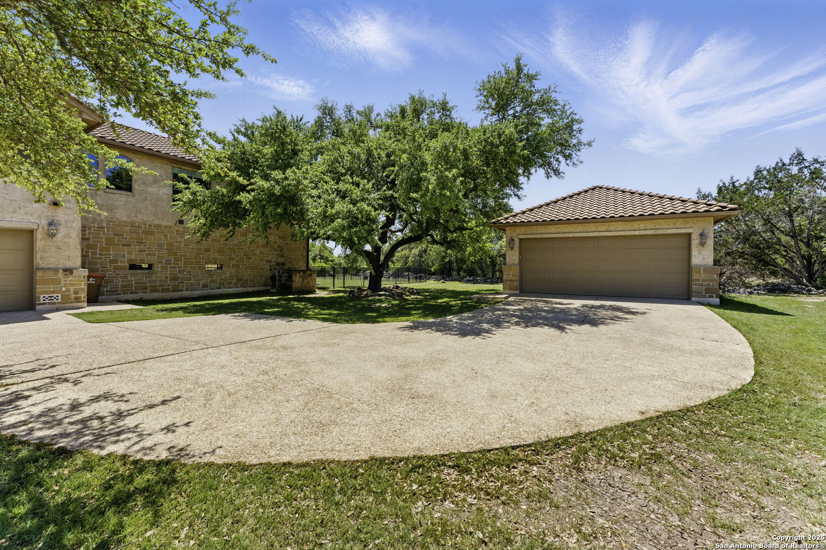 211 Macaw Lane Spring Branch, TX 78070 - Photo 4 of 85 a front view of a house with a yard and garage
