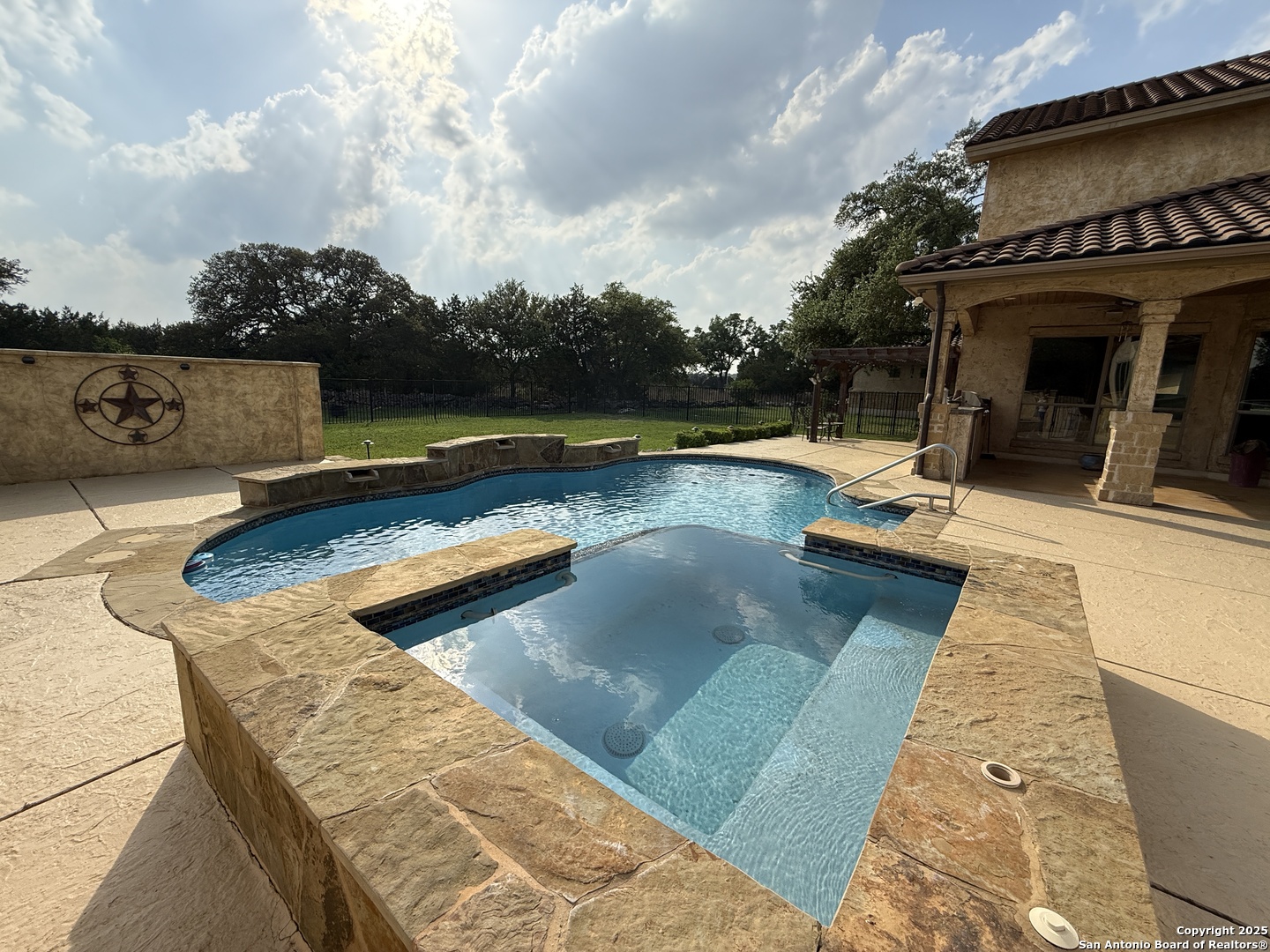 211 Macaw Lane Spring Branch, TX 78070 - Photo 49 of 85 a view of a swimming pool with lounge chair