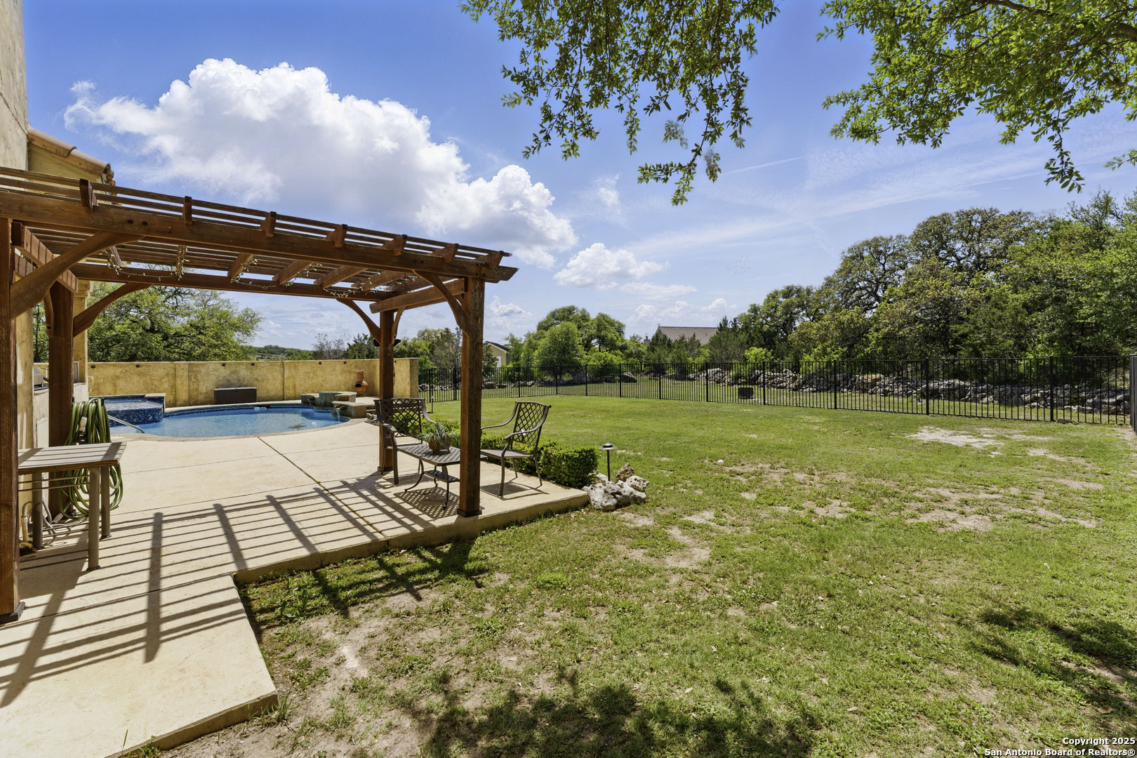 211 Macaw Lane Spring Branch, TX 78070 - Photo 51 of 85 a view of a swimming pool with a patio