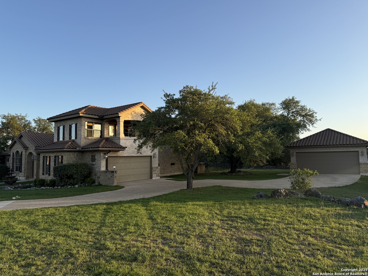 211 Macaw Lane Spring Branch, TX 78070 - Photo 54 of 85 a house view with a garden space