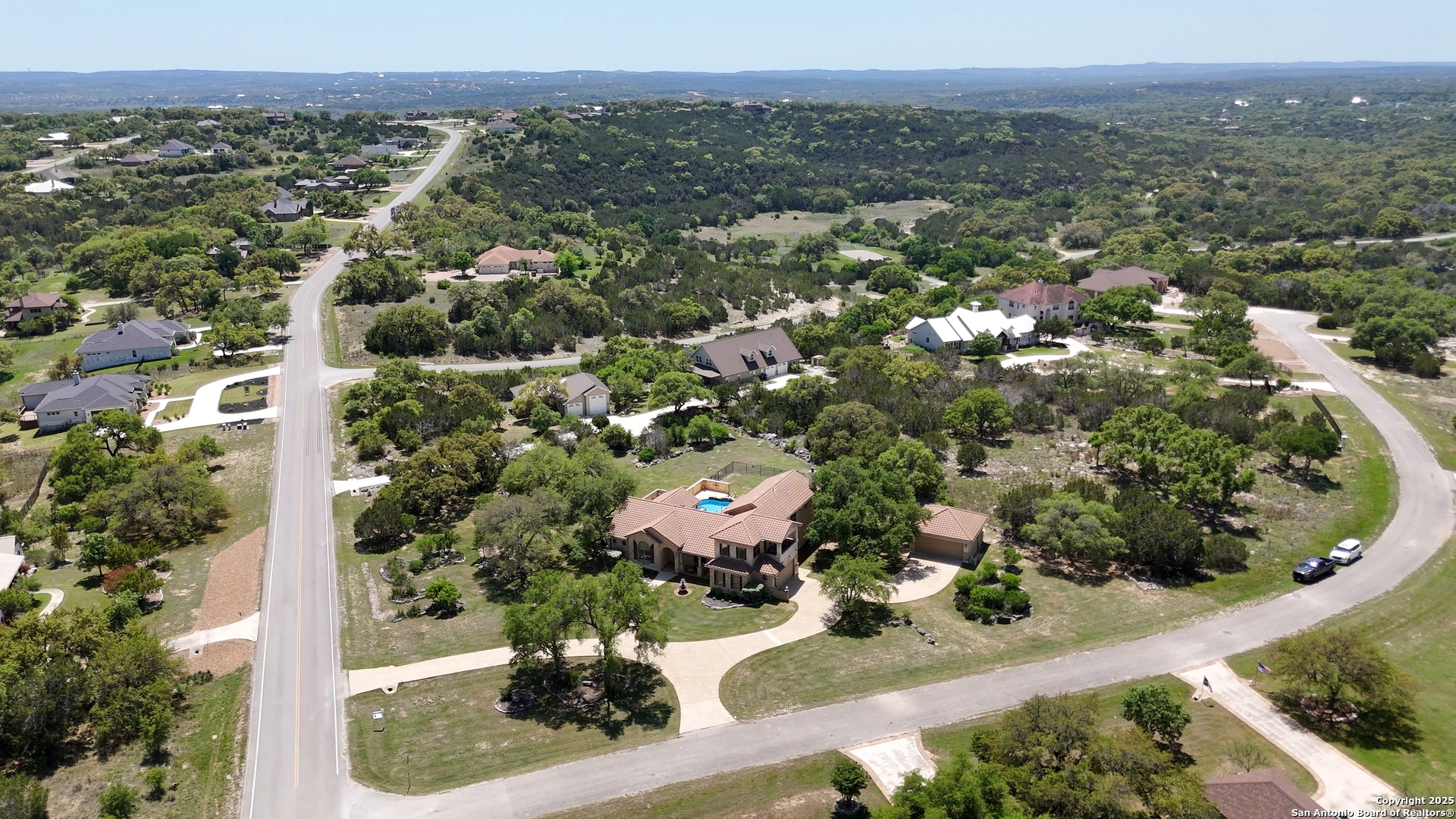 211 Macaw Lane Spring Branch, TX 78070 - Photo 61 of 85 an aerial view of a house with a yard
