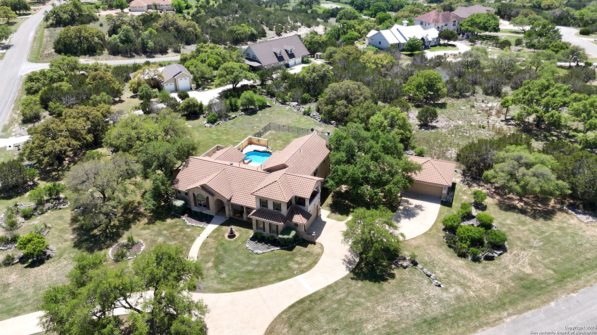 211 Macaw Lane Spring Branch, TX 78070 - Photo 62 of 85 an aerial view of a house with a yard
