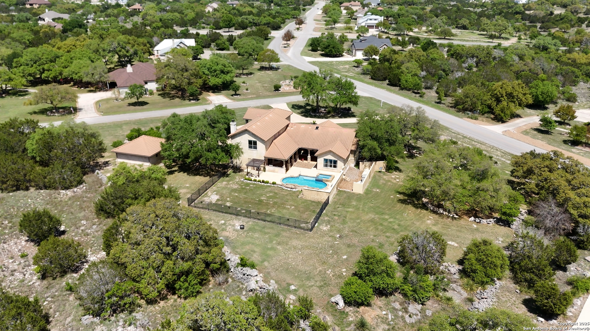 211 Macaw Lane Spring Branch, TX 78070 - Photo 66 of 85 an aerial view of a house with a yard and lake view
