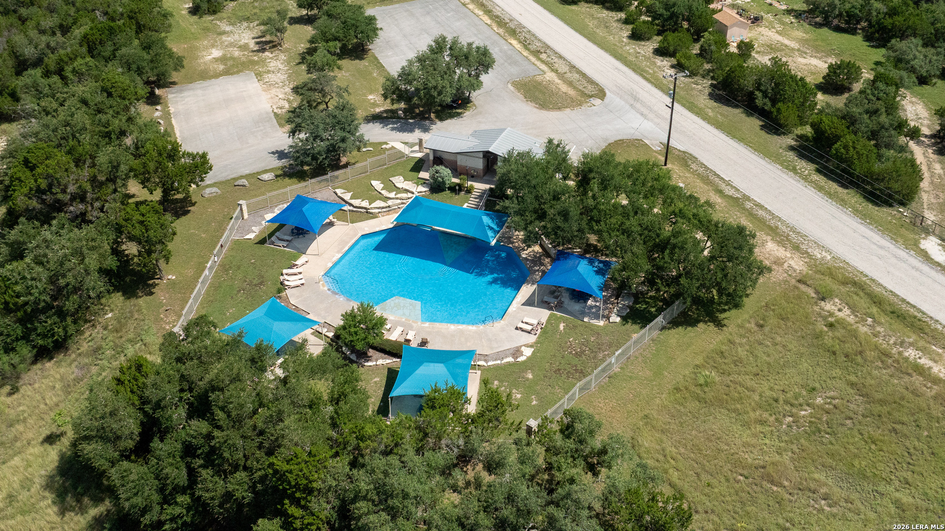 211 Macaw Lane Spring Branch, TX 78070 - Photo 75 of 85 an aerial view of a house with a yard and lake view