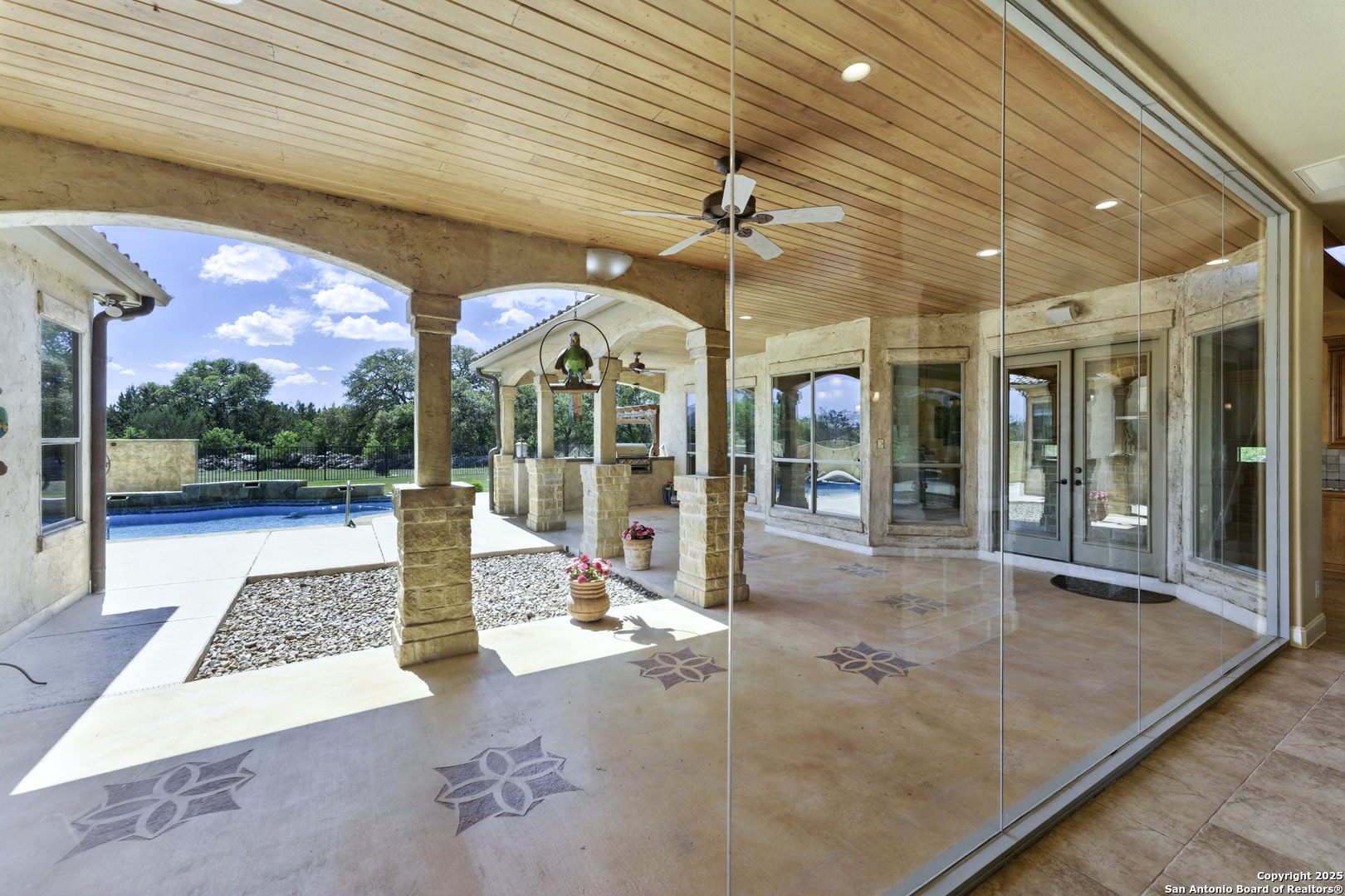 211 Macaw Lane Spring Branch, TX 78070 - Photo 9 of 85 a view of a hall with a floor to ceiling window and an outdoor space