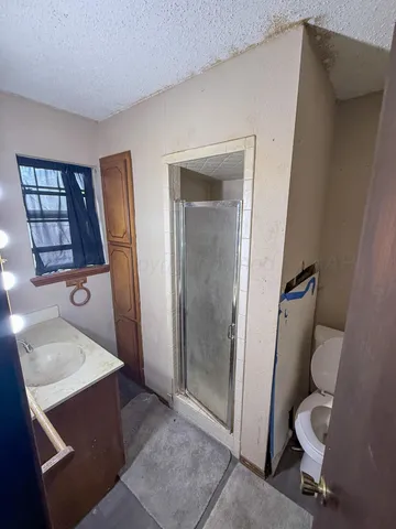 a bathroom with a sink and toilet